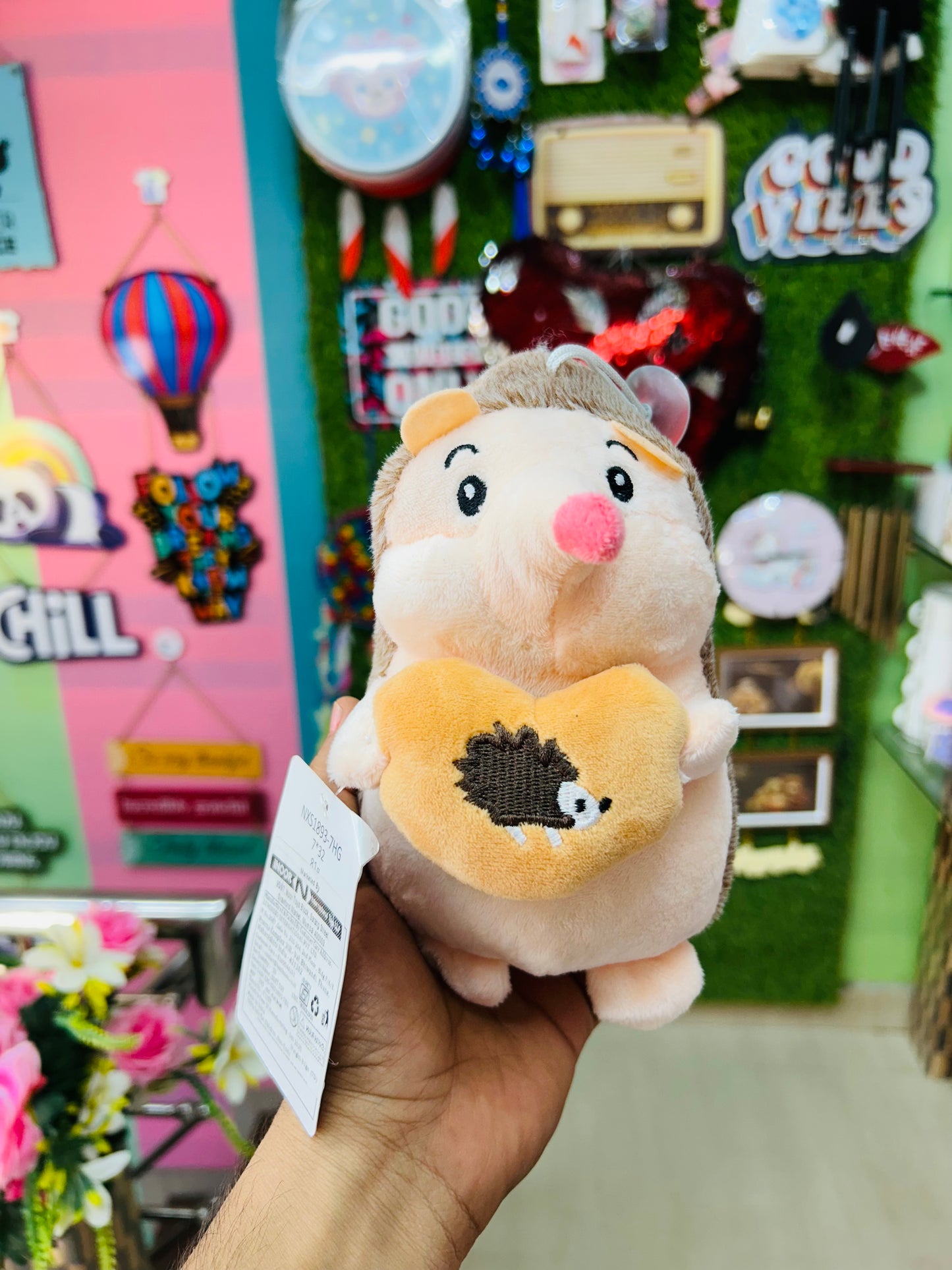 Cuddlehog - the hedgehog plushie holding a tiny buddy